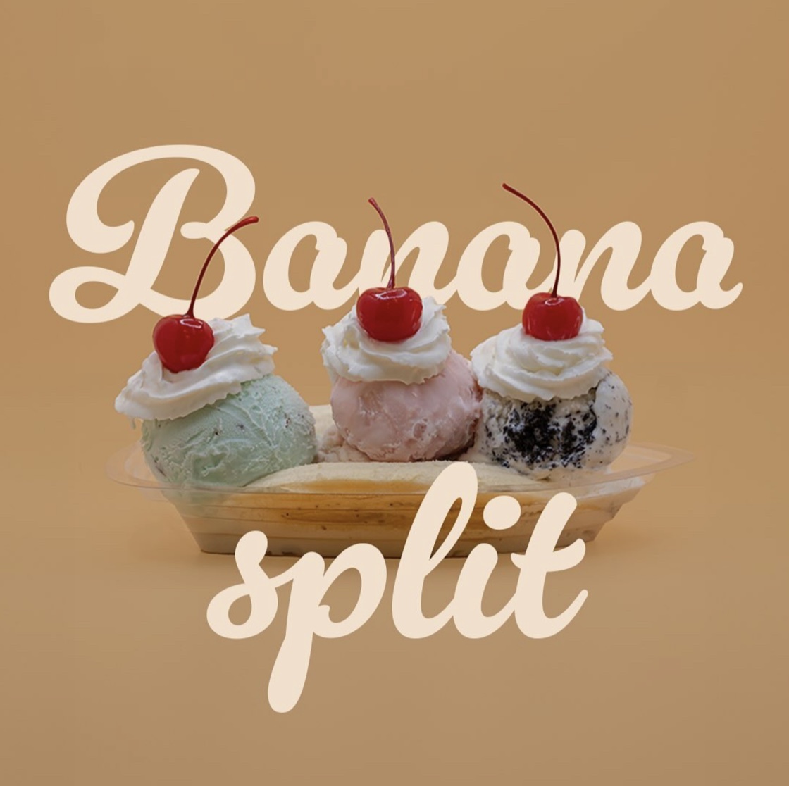 Banana split with three ice cream scoops, whipped cream and cherries